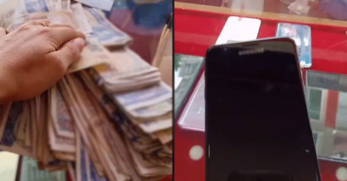 Sấp tiền lẻ trao lại cho chủ cửa hàng và người mẹ nhận lại chiếc điện thoại đời cũ. Ảnh cắt từ clip