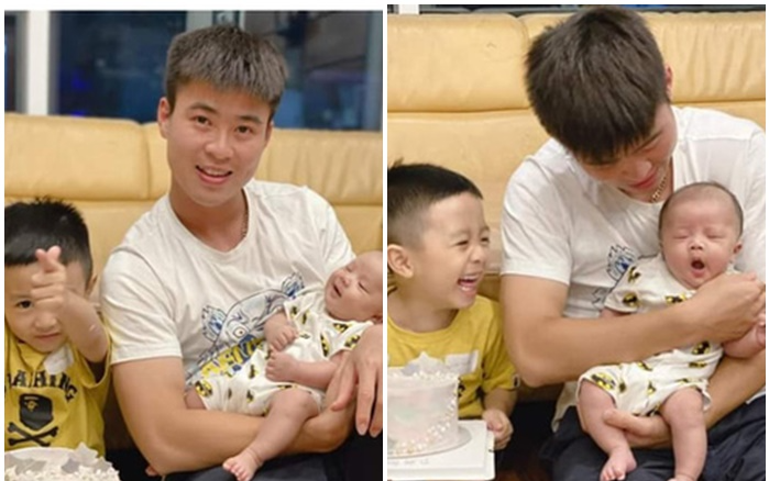 Duy Mạnh vừa bế con vừa cổ vũ Hà Nội FC Ảnh 2