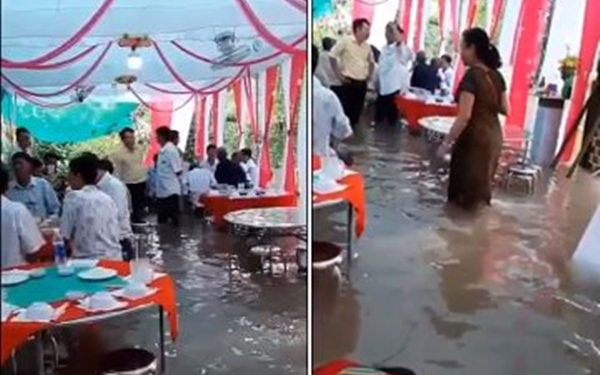 Đám cưới đúng ngày mưa lũ, gia chủ cùng quan khách ăn tiệc ngay giữa 'biển nước' mênh mông Ảnh 2