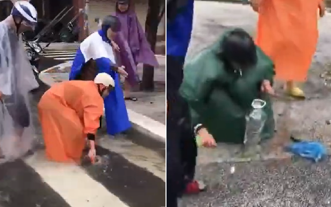 Người dân Đà Nẵng rủ nhau mặc áo mưa ra đường… bắt cá: 'Lạc quan giữa mùa mưa lũ là đây chứ đâu!' Ảnh 2