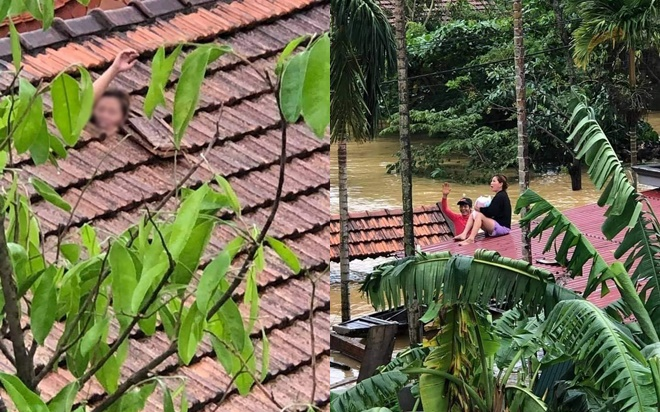 Cảm động tình người giữa cảnh mưa lũ ở Quảng Bình: Người đàn ông giúp người phụ nữ bế con nhỏ vẫy tay kêu cứu qua nóc nhà Ảnh 2