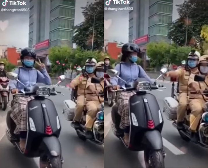 Giơ tay lên chụp ảnh khi đang chạy xe máy, cô gái giật mình khi CSGT xuất hiện yêu cầu tấp vào kiểm tra Ảnh 4