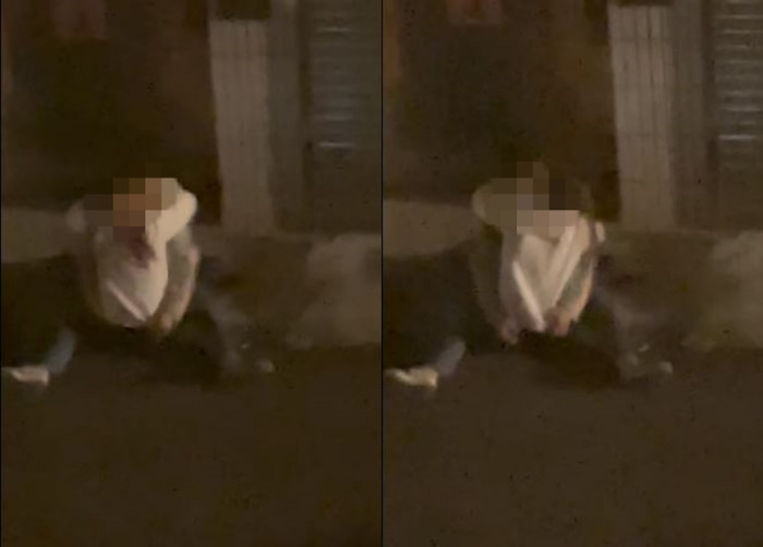 Cặp đôi ôm hôn nhau ngoài đường trong tư thế nhạy cảm. 