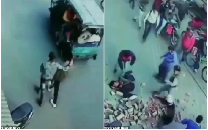 Khoảnh khắc kinh hoàng: Cả đống gạch rơi vào hai người đàn ông đang đi đường Ảnh 2