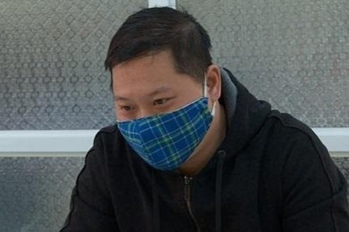 Đối tượng Bùi Văn Định tại cơ quan công an sau 10 năm trốn truy nã. Ảnh: Zing