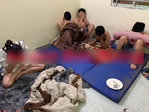 Nhóm thanh niên bị bắt quả tang sử dụng trái phép chất ma túy. Ảnh: CAND