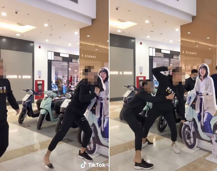 Hai nam thanh niên làm clip định đánh vào mặt hình quảng cáo của Hải Tú.