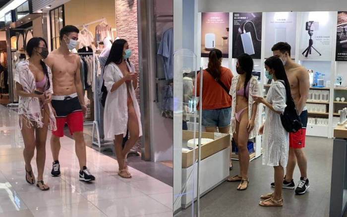Hai cô gái mặc bikini dắt theo chàng trai cơ bắp đi mua sắm ở trung tâm thương mại Ảnh 2