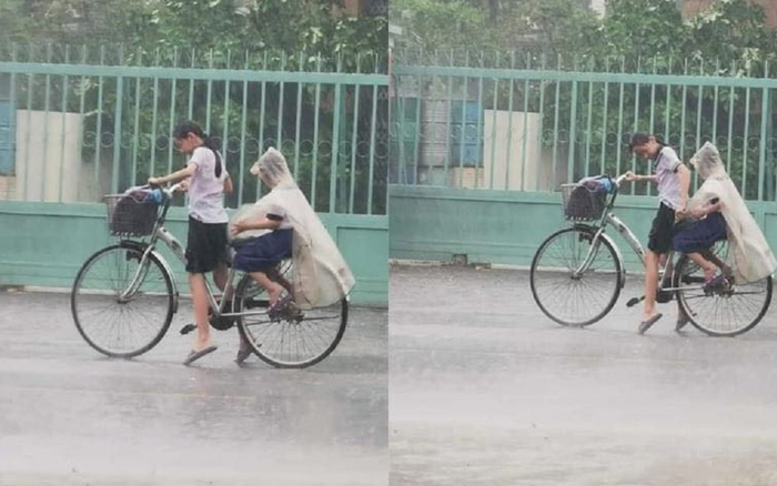 Nhường áo mưa cho em trai, cô bé tiểu học loay hoay với chiếc xe đạp giữa trời tầm tã mưa gây xúc động Ảnh 2