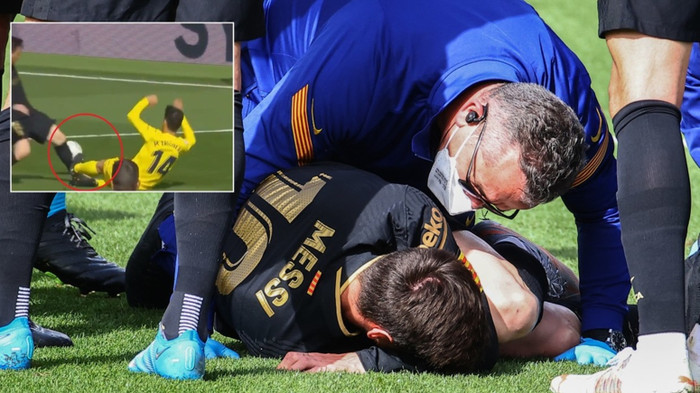 Messi nằm sân đau đớn sau pha vào bóng của Manu Trigueros.
