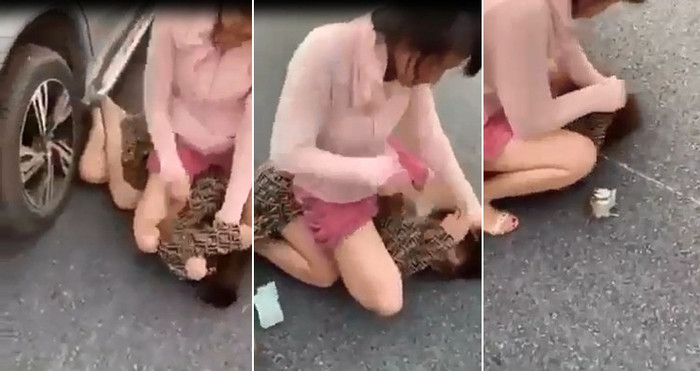 Clip: Vợ đè bồ nhí xuống đường, cầm giày cao gót phang tới tấp vào đầu dù bị can ngăn Ảnh 1