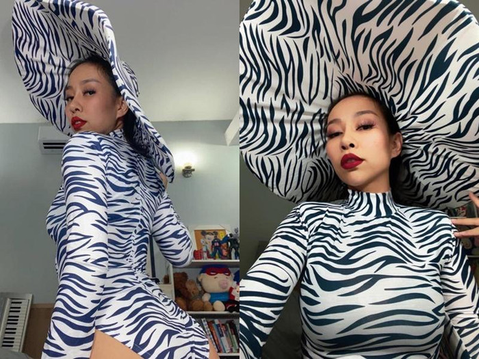 Thảo Trang chơi trội với swimsuit cùng nón rộng vành in ấn hoạ tiết.