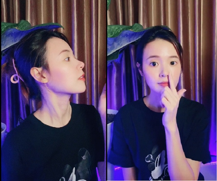 Midu tự véo mũi đáp trả tin đồn 'dao kéo' đồng thời khoe luôn dáng mũi cao thẳng tắp.