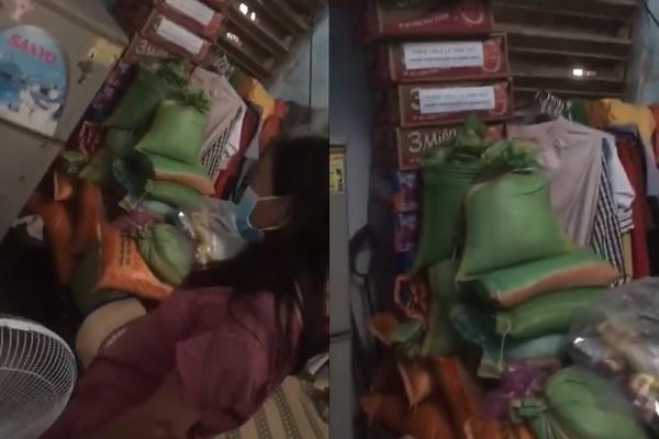 Hàng chục thùng mì, bao gạo được xếp trong nhà người phụ nữ. 