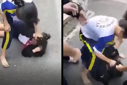 Nữ sinh bị bạn đánh hội đồng. Ảnh cắt từ clip