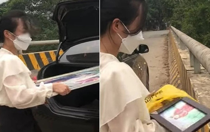 'Nóng giận mất khôn', người phụ nữ đem ảnh cưới quẳng xuống sông liền bị chỉ trích bởi 2 lý do này Ảnh 2