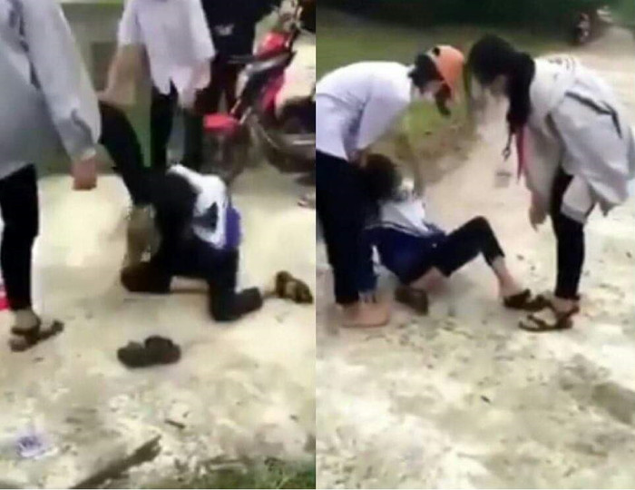 Nữ sinh bị 2 bạn nữ khác đánh dã man giữa đường. Ảnh cắt từ clip