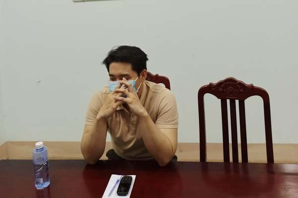 Nguyễn Minh L. làm việc với cơ quan công an chiều nay 28/3. Ảnh: VietNamNet