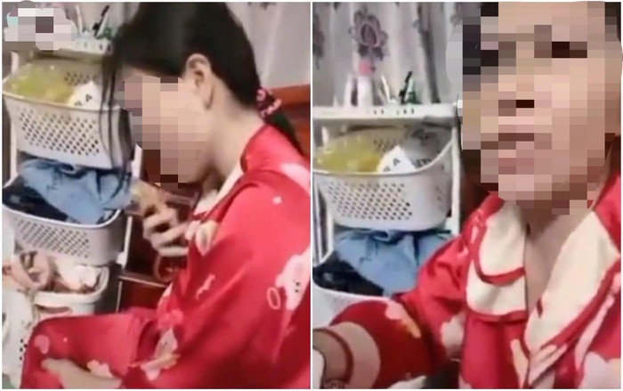 Người vợ gọi điện thoại cho nhân tình trước mặt chồng, nhờ nhân tình nói giúp một câu để được về ở cùng chồng. Ảnh cắt từ clip