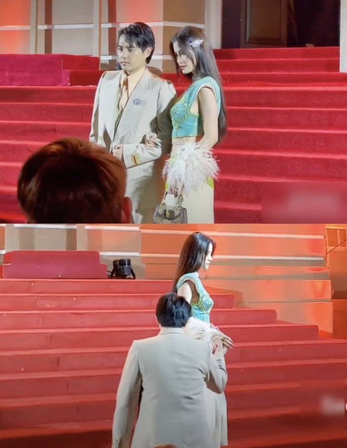 Ông Cao Thắng nhẹ nhàng dìu vợ lên thảm đỏ.