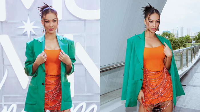 Bước vào vòng tranh tài đầu tiên trong tập 3, Kim Duyên chơi hệ 'sặc sỡ' để mở đầu cuộc chiến máu lửa với mentor Mâu Thuỷ. Cô chọn một chiếc blazer xanh thời thượng kết hợp cùng váy ống cam gợi cảm ôm trọn cơ thể. Chi tiết belt với những dải tua rua lạ mắt là điểm nhất của trang phục.