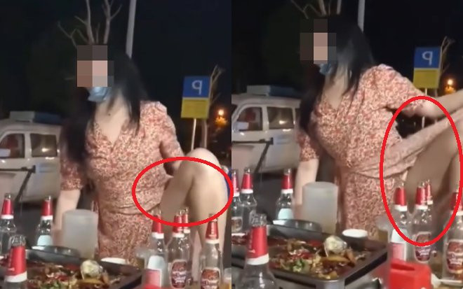 Say men, cô gái co chân vén váy phản cảm giữa chốn đông người Ảnh 2