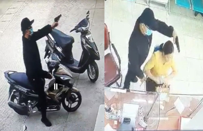 Camera phòng giao dịch ghi lại cảnh thanh niên cầm vật giống súng xông vào cướp tiền