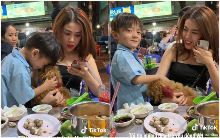 Ấm áp khoảnh khắc bé trai bán hàng rong say mê âu yếm cún con và phản ứng đầy dịu dàng của vị khách nữ Ảnh 2